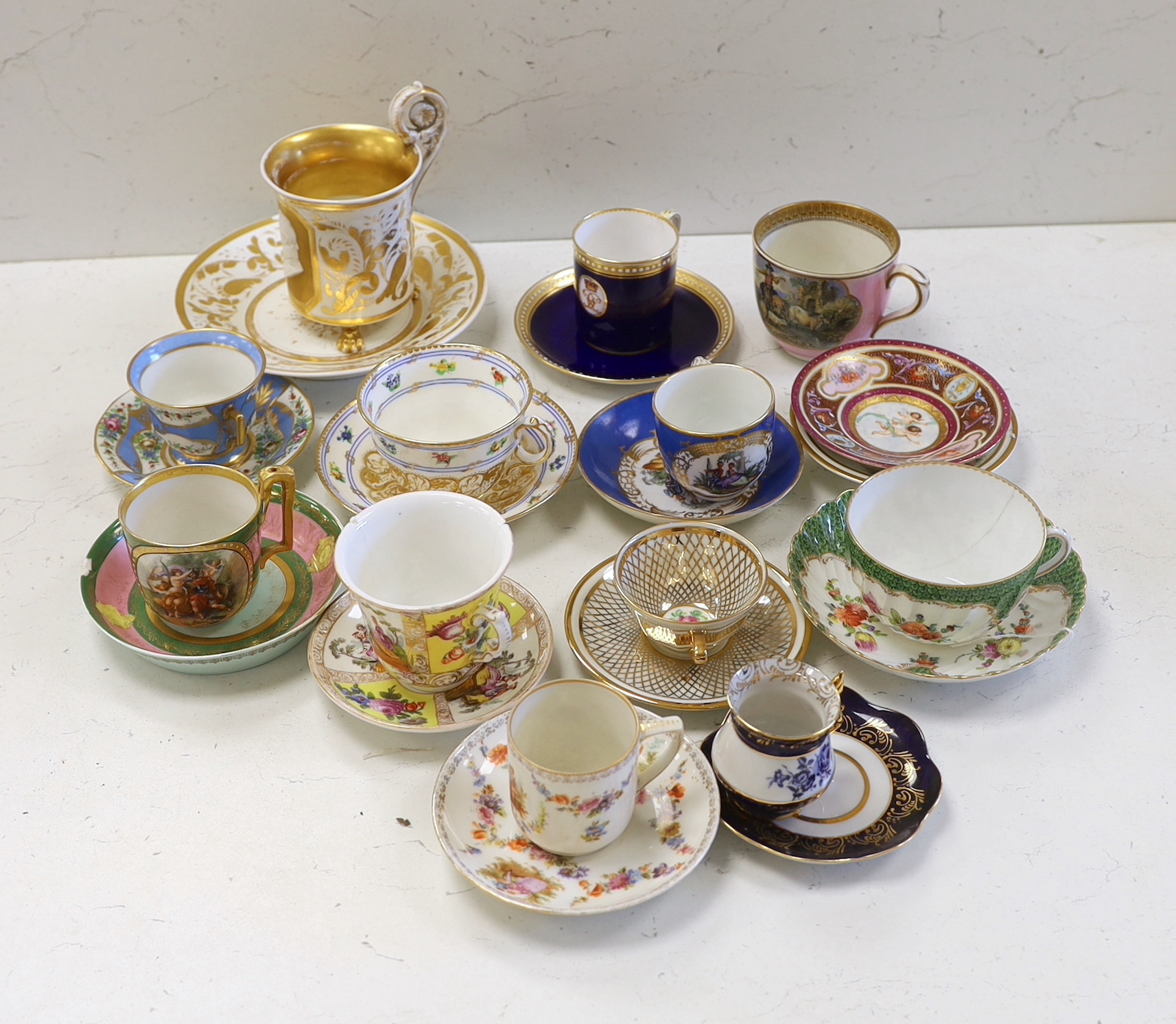 A collection of European cabinet cups and saucers, including a gilded Berlin cup and saucer (12)